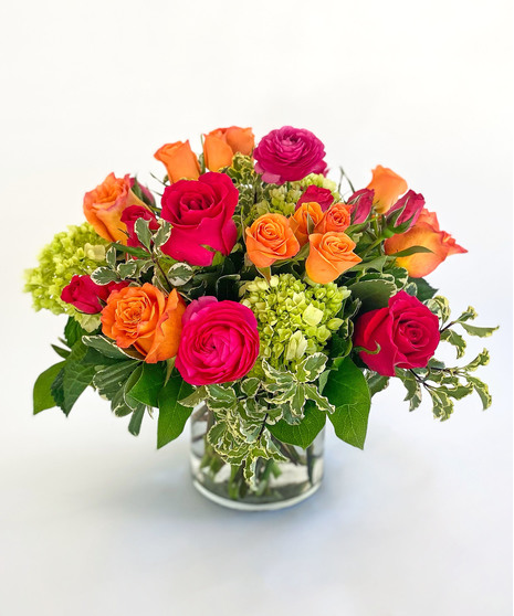 Blend of garden flowers in peach, green and pink